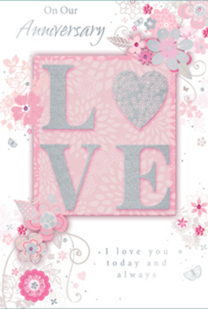 This anniversary card is captured in soft, even lighting that highlights every delicate detail, as if it were resting on a countertop in a cosy New Barnet flower shop. In the centre, the word "LOVE" takes pride of place, formed from raised letters with a frosted, glittering surface that shimmers between blush pink, pearlescent white, and silver. The letters look almost like they have been gently iced, their edges catching the light in a way that invites the fingertips to linger and explore the texture. The central word sits against a blush-toned rectangle, subtly framed to stand out from the rest of the card, like the focal blooms in a carefully composed bouquet. Around this focal point, wispy, hand-drawn flowers and leaves unfurl across the card's face, their lines fine and flowing. Roses, tiny blossoms, and curling stems are suggested through stylized shapes rather than strict botanical accuracy, reminiscent of a florist's quick pencil sketches while planning an anniversary arrangement for a couple living off nearby East Barnet Road. The flowers are tinted in talc-soft pinks, creamy whites, and light greys, with occasional flashes of silver foil that give the impression of moonlight resting on petals. These floral accents frame the card without overwhelming it, allowing plenty of calm, open space that enhances the sense of serenity. Alongside the artwork, refined script lettering shares a heartfelt anniversary message, the words shaped in a light, looping style that echoes the swirling vines and floral curls nearby. The overall impression is of a gentle, dreamlike celebration of enduring love, as tender and thoughtfully arranged as a hand-tied bouquet delivered on an anniversary morning in New Barnet.